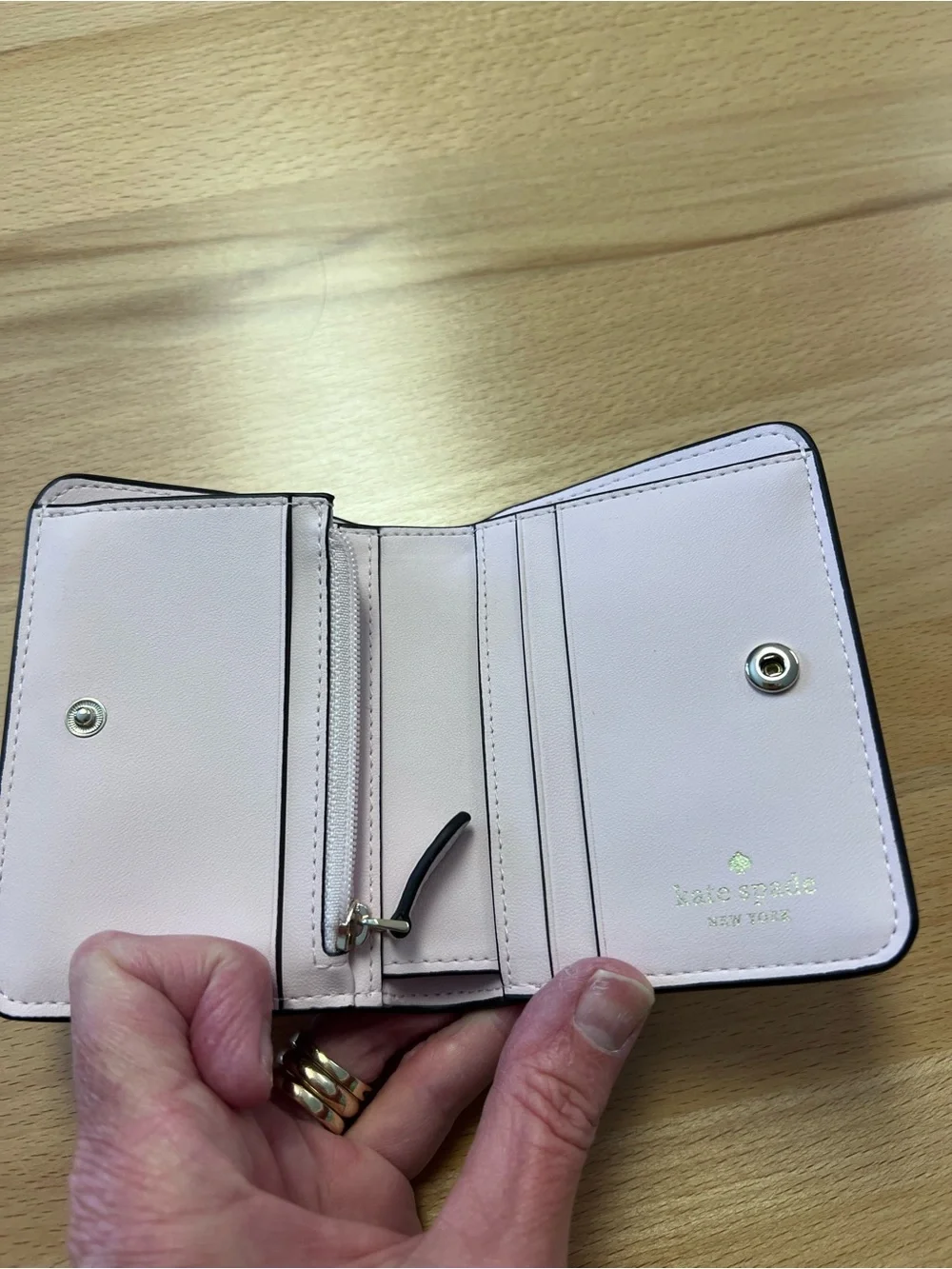 kate spade Light Pink Pebbled Leather wallet with Gold Logo